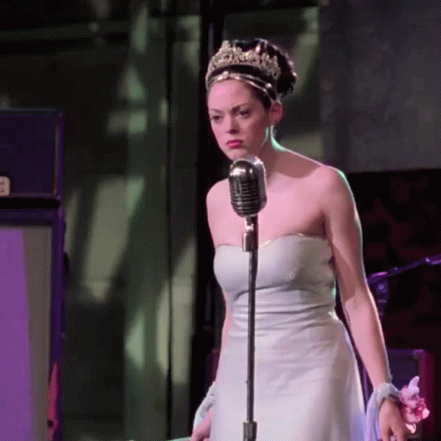 Woman in White Dress Singing Tiara
