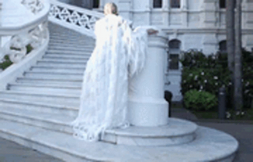 Woman in White Dress with Angel Wings