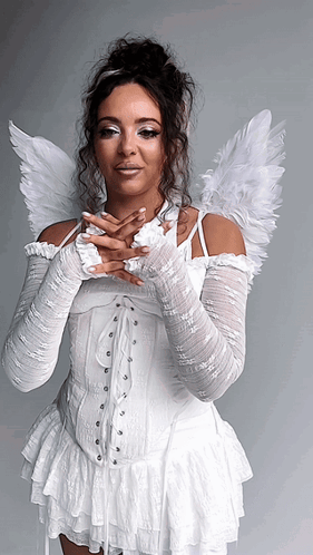 Woman in White Dress with Angel Wings