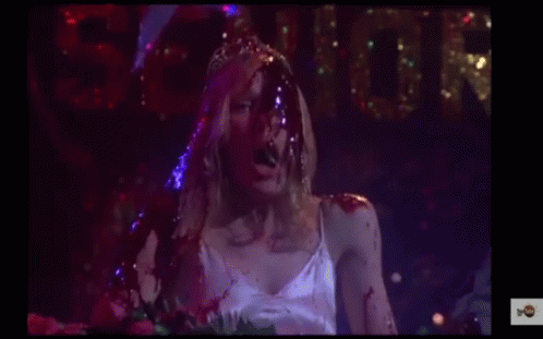 Woman in White Dress with Blood on Face