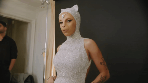 Woman in White Dress with Cat Headpiece