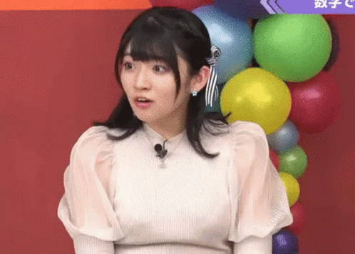 Woman In White Dress With Colorful Balloons GIF