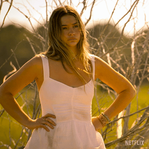 Woman in White Dress with Hands on Hips Netflix