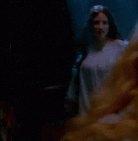 Woman in White Dress With Long Sleeves Dancing