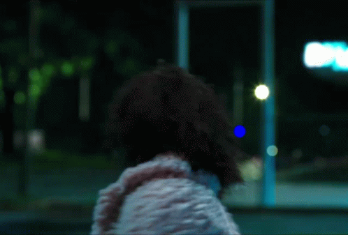 Woman in White Fur Coat Blue Sign A