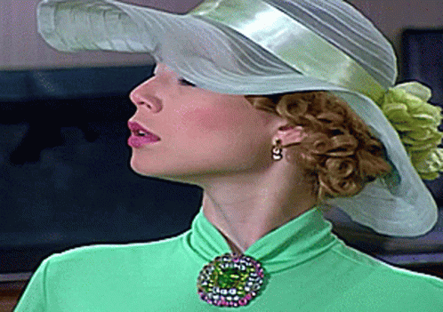 Woman in White Hat and Green Top