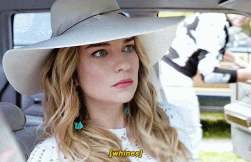 Woman in White Hat Whines in Car