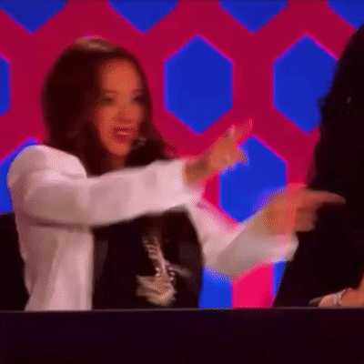 Woman in White Jacket Dancing on Stage
