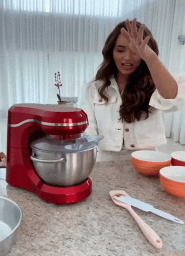 Woman in White Jacket with Red Stand Mixer