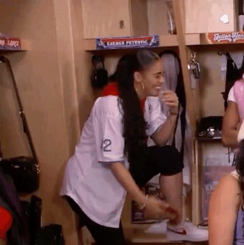 Woman in White Jersey Number 12