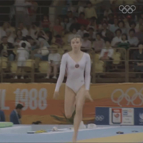 Woman in White Leotard Performing