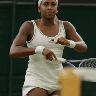 Woman in White New Balance Tank Top Playing Tennis