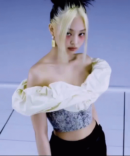 Woman in White Off-Shoulder Top and Black Pants