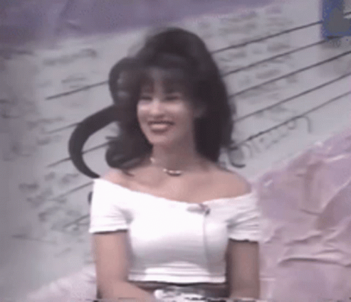 Woman in White Off-Shoulder Top Smiling at Piano