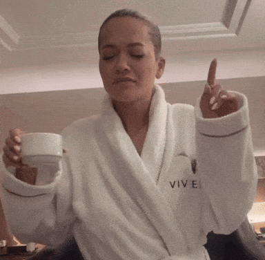 Woman In White Robe Saying Vivel GIF