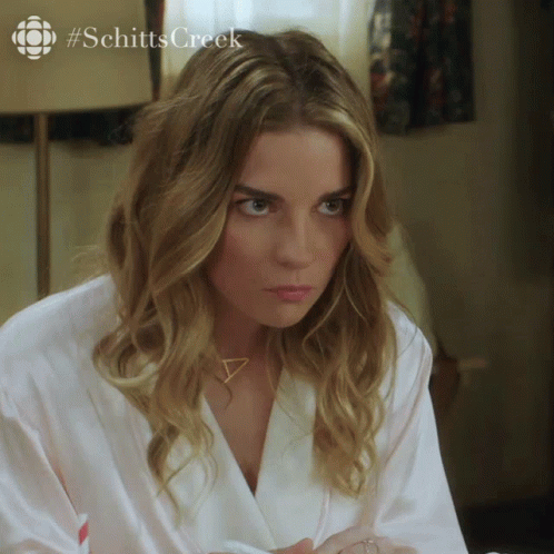 Woman in White Robe Schitt's Creek