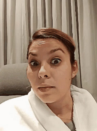 Woman In White Robe Surprised GIF