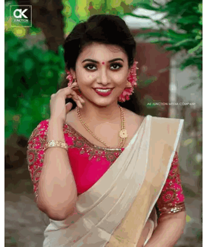 Woman in White Saree and Pink Blouse
