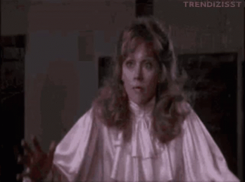 Woman in White Satin Blouse Making Funny Face