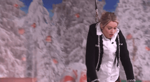 Woman In White Shirt And Black Jacket With Chanel Logo GIF