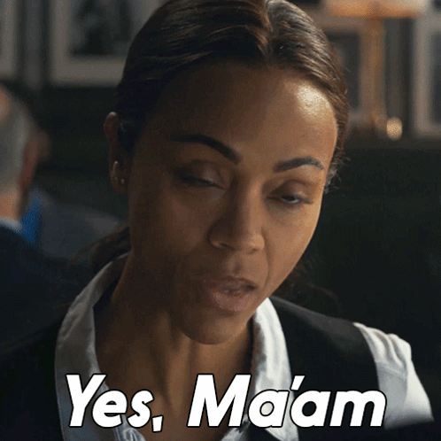 Woman In White Shirt And Black Vest Says Yes Maam GIF