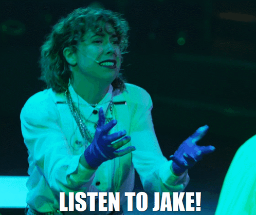 Woman in White Shirt and Blue Gloves Says Listen to Jake