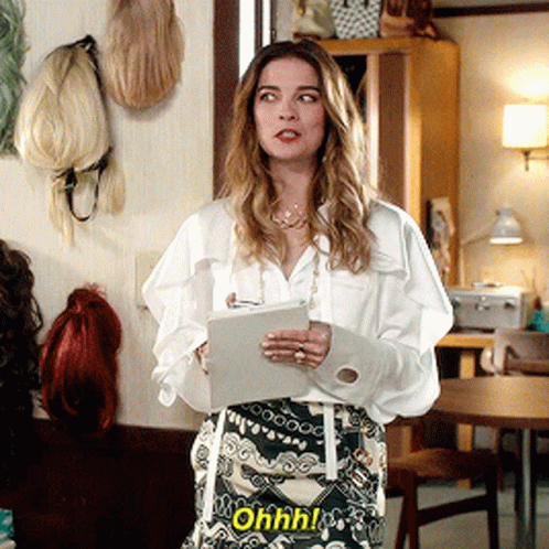 Woman in White Shirt and Green Skirt Says Ohhh