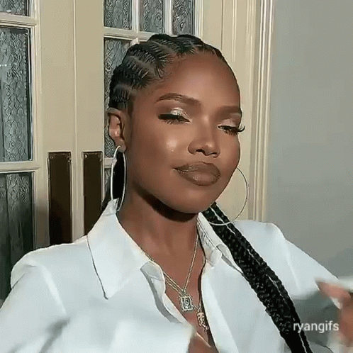 Woman in White Shirt and Hoop Earrings