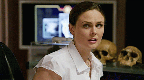 Woman in White Shirt at Computer