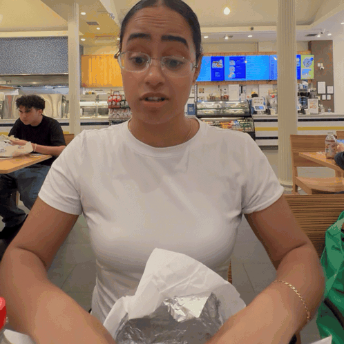 Woman In White Shirt At Ice Cream Menu GIF