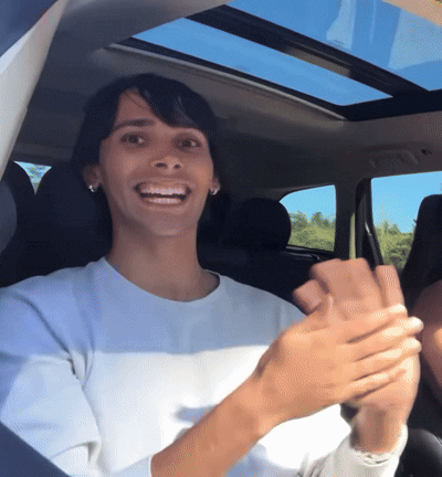 Woman In White Shirt Clapping In Car GIF
