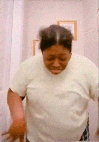 Woman in White Shirt in Front of Mirror