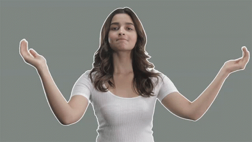 Woman in White Shirt Making Hand Gesture