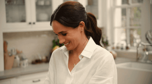 Woman in White Shirt Smiling