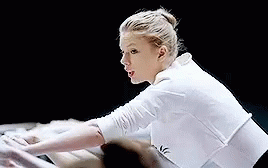 Woman in White Shirt Stretching Arms