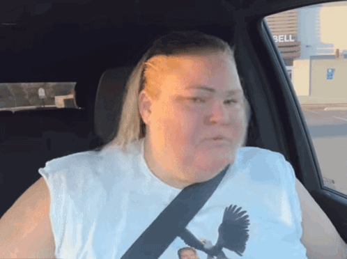 Woman In White Shirt With Bird Sitting In Car With Bell Sign GIF