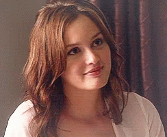 Woman in White Shirt with Long Brown Hair Smiling