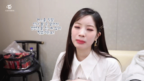 Woman in White Shirt With Twice Logo