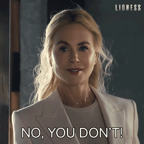 Woman in White Suit Saying No You Don't