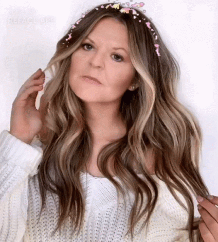 Woman in White Sweater and Headband with Sprinkles