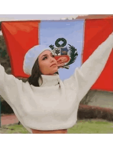 Woman in White Sweater Holding Flag