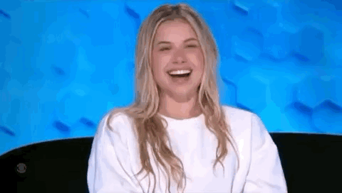 Woman In White Sweater Laughing GIF