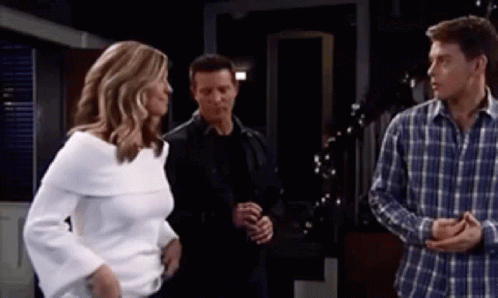 Woman In White Sweater Next To Men In Plaid Shirts GIF
