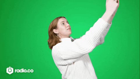Woman in White Sweater Taking Selfie