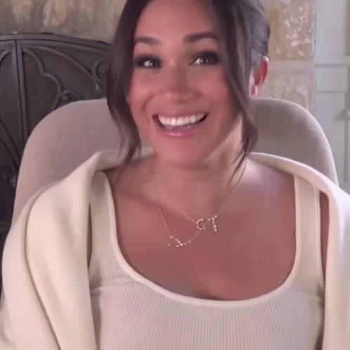 Woman In White Tank Top And Gold T Necklace GIF