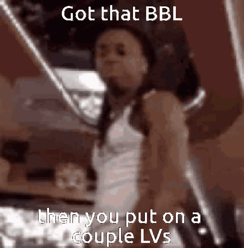 Woman in White Tank Top Got That BBL