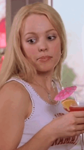 Woman in White Tank Top Holding Drink With Umbrella