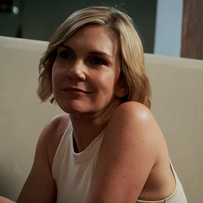 Woman in White Tank Top on Couch
