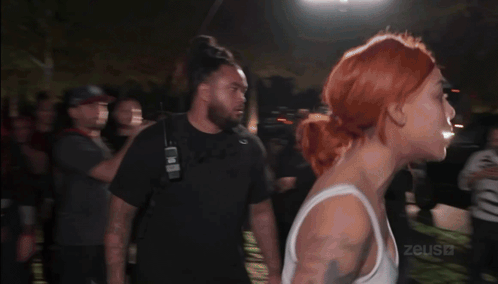 Woman In White Tank Top Punched By Man GIF