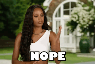 Woman in White Tank Top Saying Nope